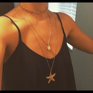 Gold layered necklace pendant shell star